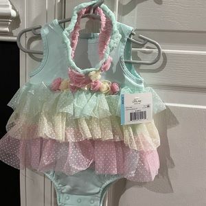 Brand new tu tu with matching head bands.